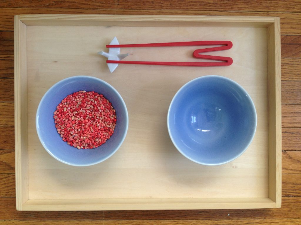 Montessori Practical Life: Chopstick Exercise - check out this blog to see all of the Montessori practical life lessons, including the spooning activities