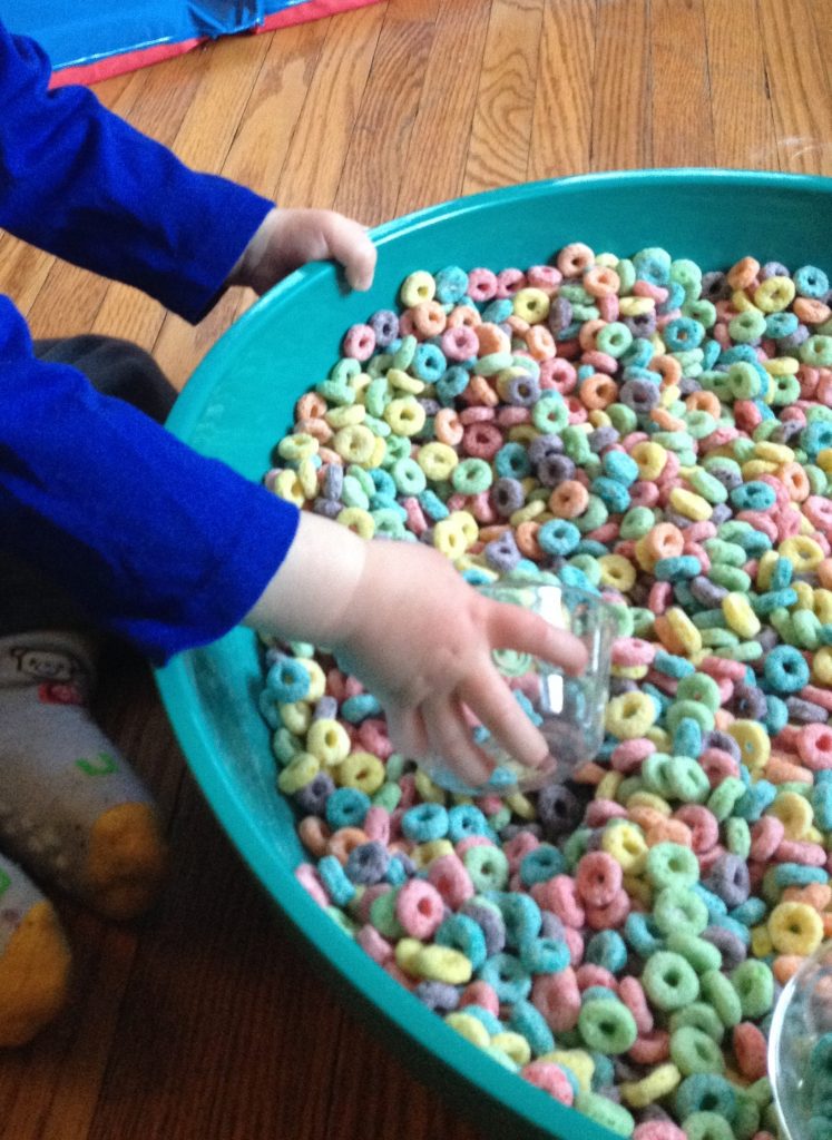 Cereal Sensory Bin: froot loops scooping, part of 7 ways to play with Froot Loops