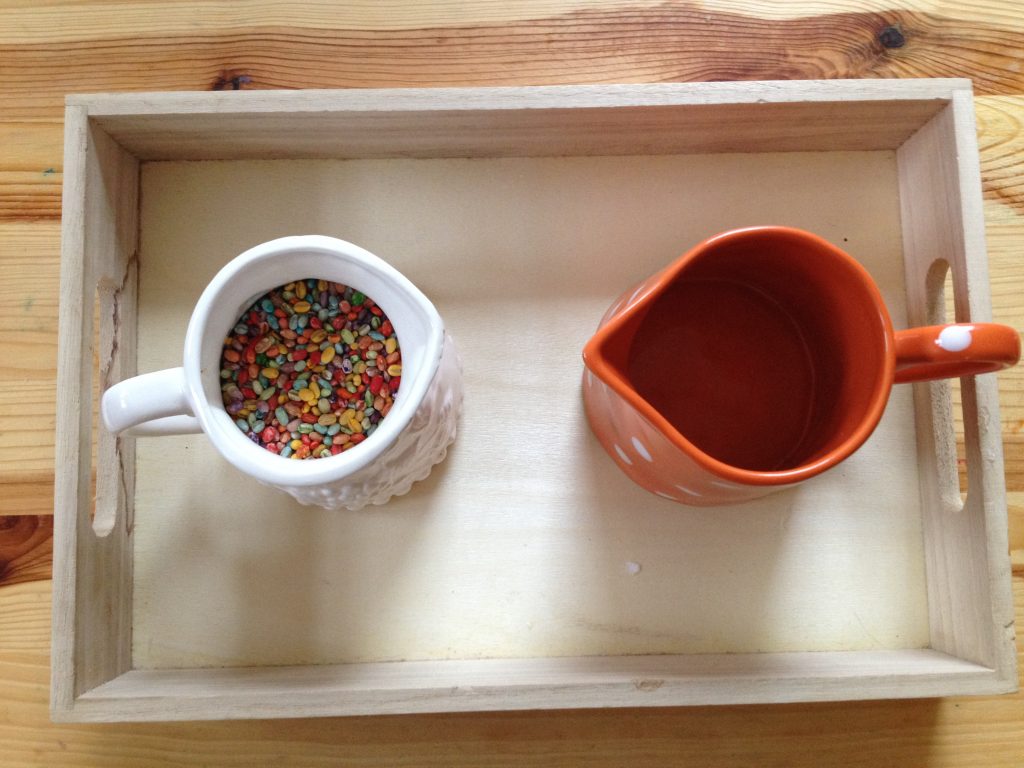 Montessori Practical Life Lesson: We used rainbow coloured barley to practice dry pouring, an essential Montessori practical life skill