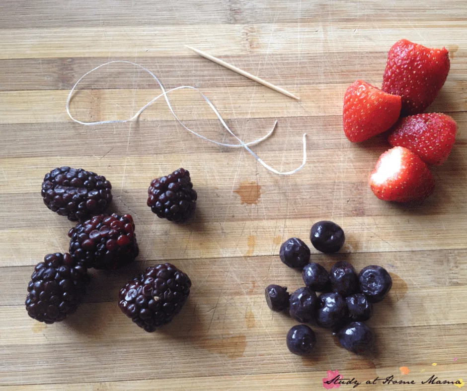 Materials to make your own berry bracelets - a great activity for kids in the kitchen, and a fun way to get them to eat their fruit. An easy snack for kids