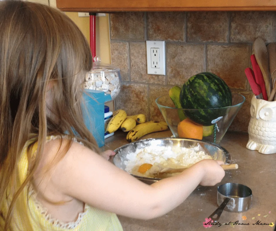 Ella making a pineapple upside down skillet cake