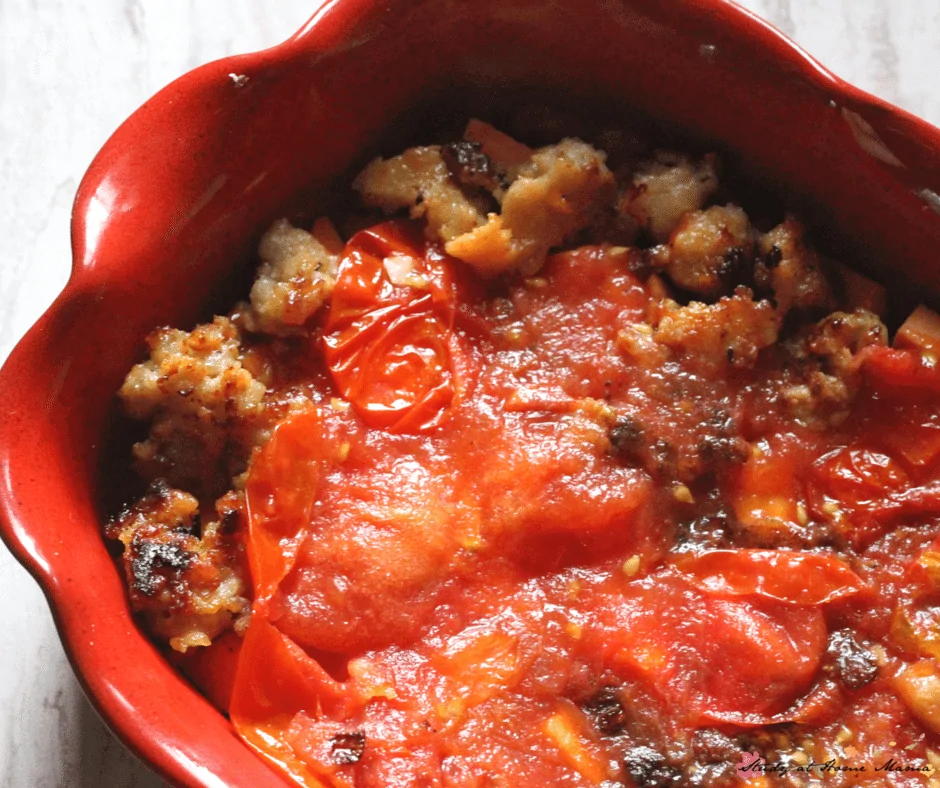 Homemade roasted tomatoes top off the sausage layer in this healthy breakfast casserole