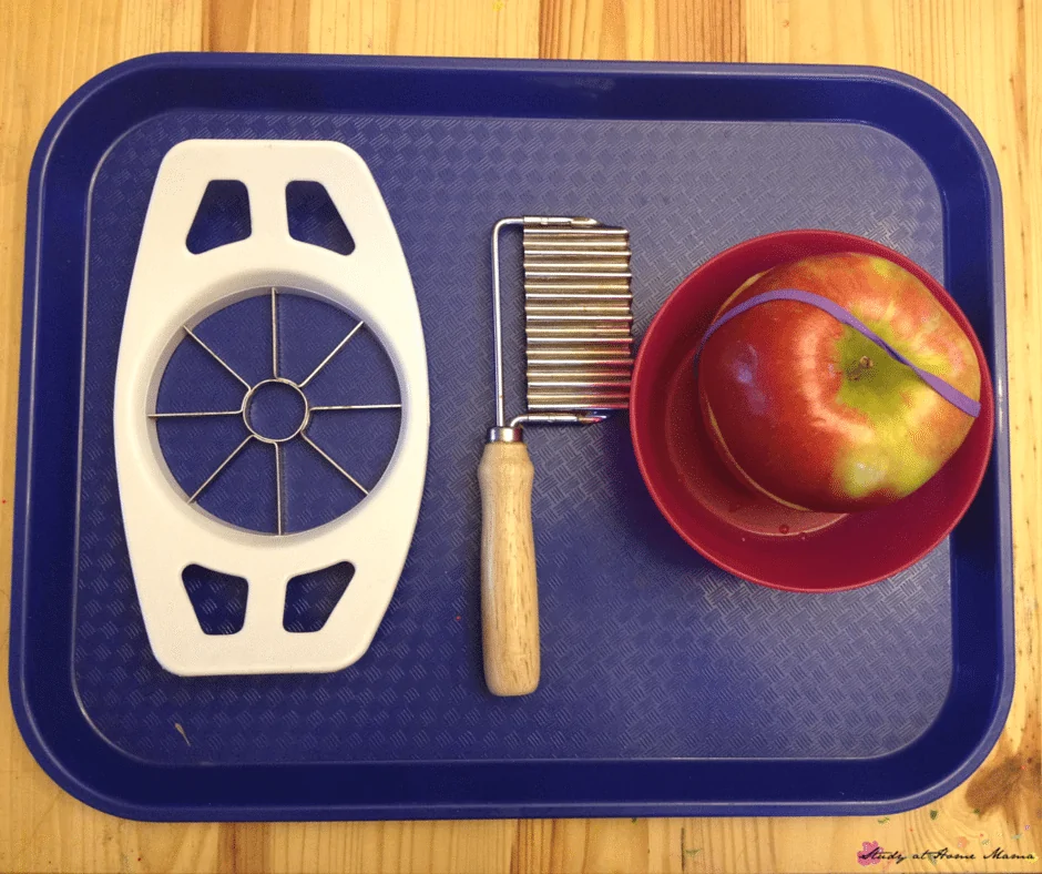 Apple cutting tray set-up used in the Montessori lesson for cutting an apple