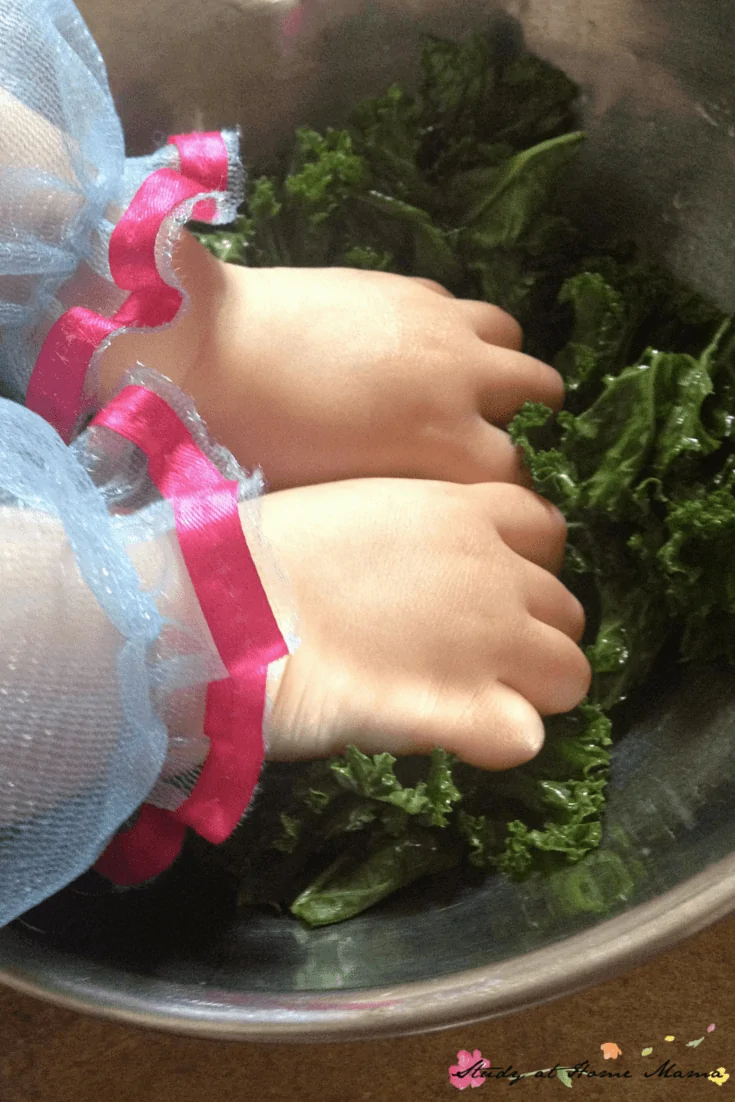 Kids Kitchen: Kale Chips - squishing the oil onto the kale for homemade kale chips is a great sensory activity for kids