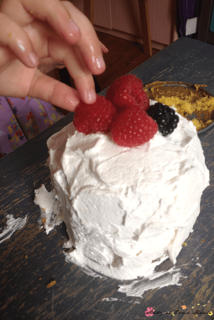 Kids Kitchen: Mango Cake - a light mango cake topped with a homemade vanilla whipped cream and fresh raspberries. An easy recipe the kids will love making!