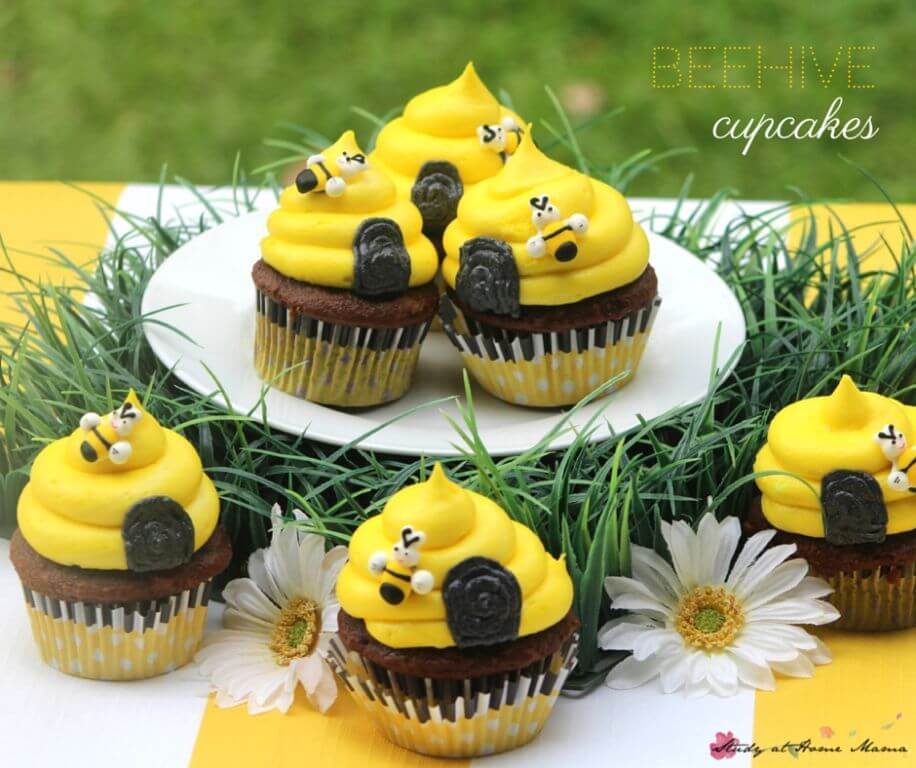 Cute Beehive Cupcakes - perfect for a Bee Themed Birthday Party. An easy chocolate cupcake topped with a honey-touched buttercream frosting, these sweet birthday cupcakes are simple and fun.