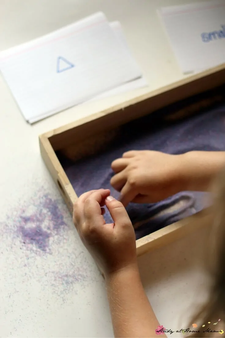 Where the Wild Things Are Book Activity: tracing shapes in the Montessori Sand tray - bigger and smaller prompts