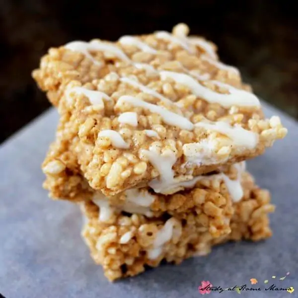 An easy kids' kitchen recipe, these pumpkin spice rice krispie treats can be ready in less than 10 minutes, made with real pumpkin & a cream cheese drizzle