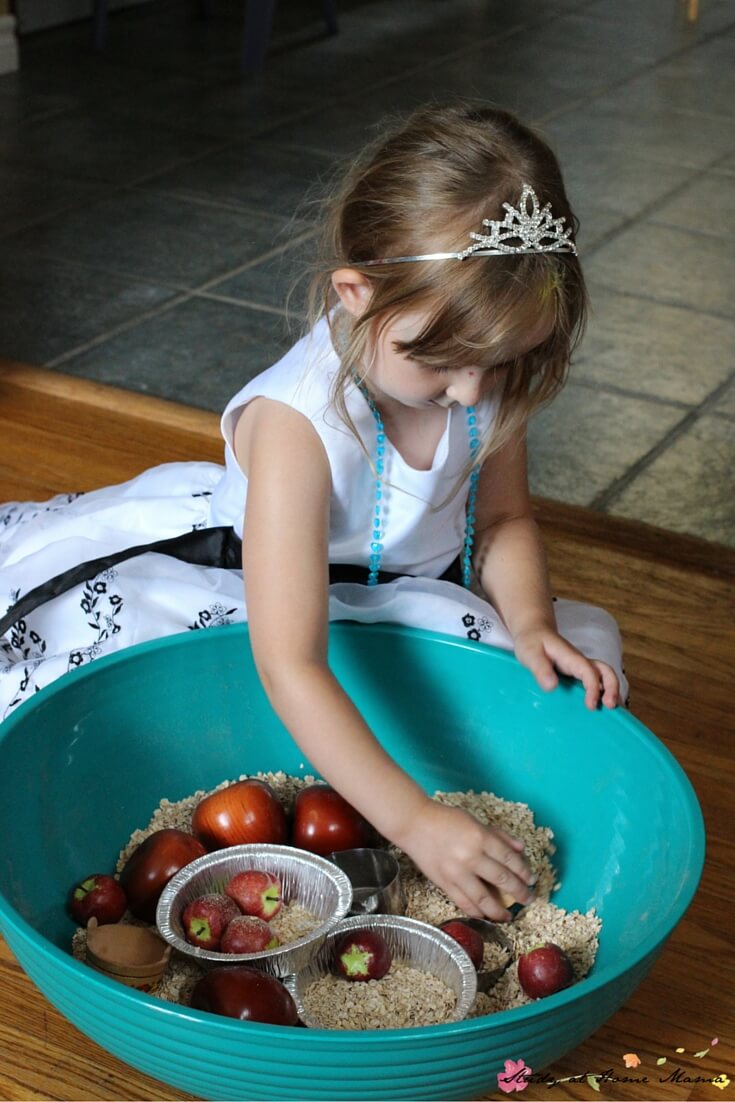 Encourage children to practice counting, fine motor skills, and descriptive language with this fall-themed sensory bin for an apple pie