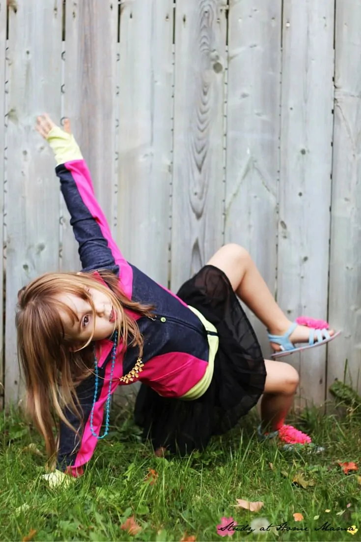 Modified triangle or side plank pose for kids, part of a fall themed yoga for kids sequence