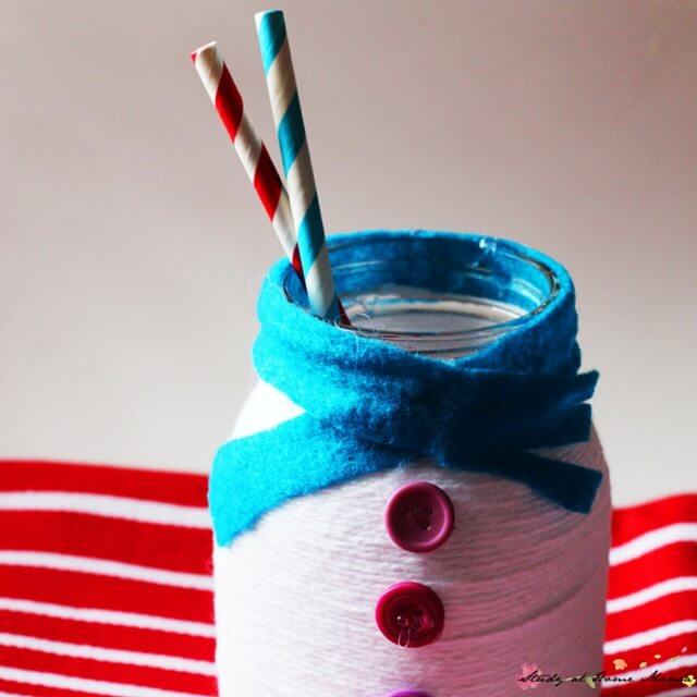 You can use this snowman mason jar craft as a candle holder or to hold utensils or straws at your next Christmas party