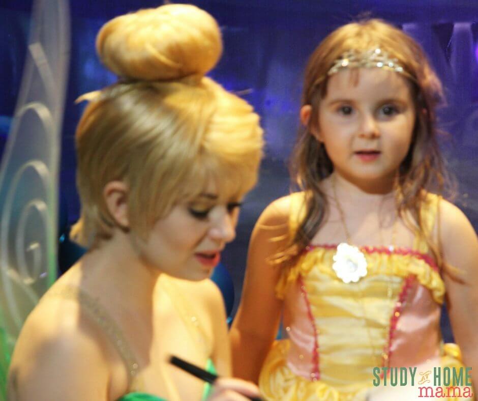Ella meeting Tinkerbell at Disney World