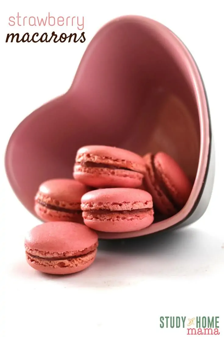 Don't miss out on these delicious Stawberry Macarons with their airy, chewy texture inside with a soft crunch exterior. Perfect to make for the love in our life or share them with your kids! Study At Home Mama has special tips to make these yummy macarons turn out just perfect. The perfect Valentine's Day cookie recipe!