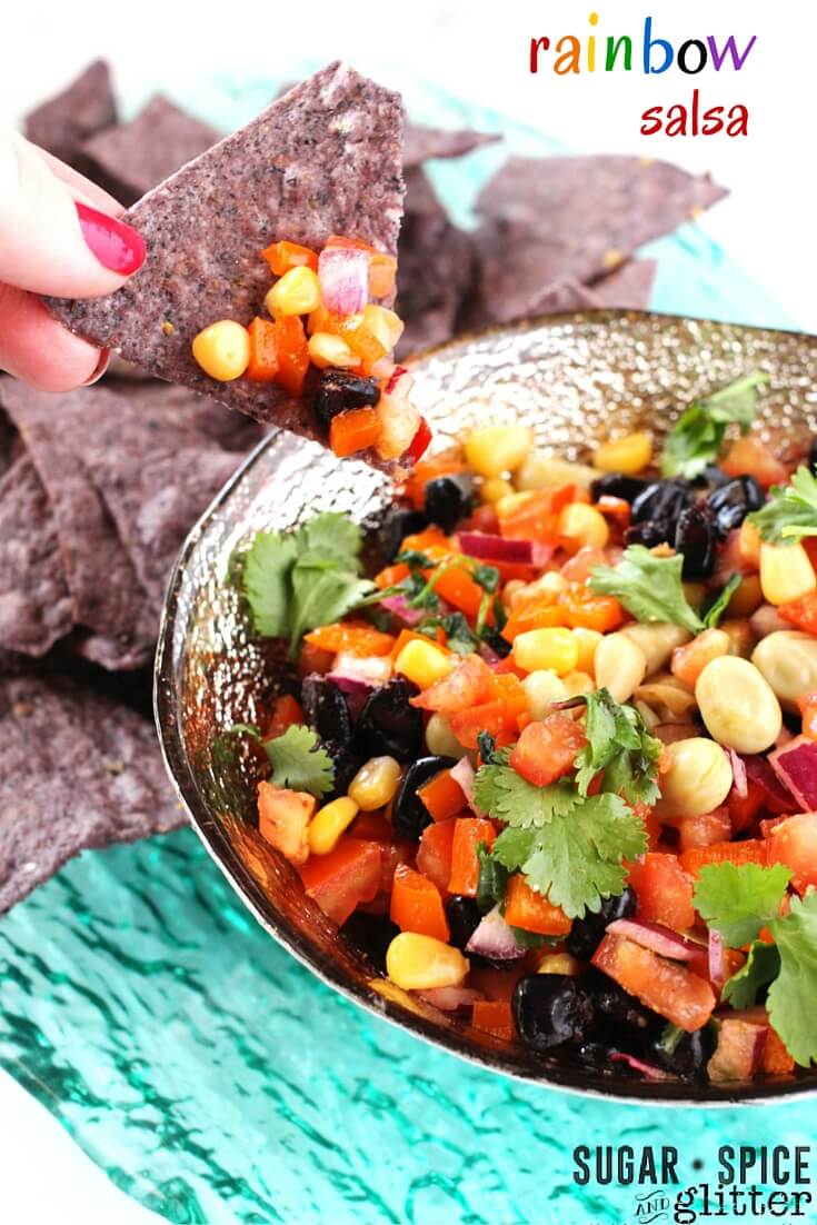 A healthy rainbow recipe your whole family will love! This fresh rainbow salsa lets your kids eat a rainbow of vegetables, while also being an easy healthy snack the grown-ups will love, too!