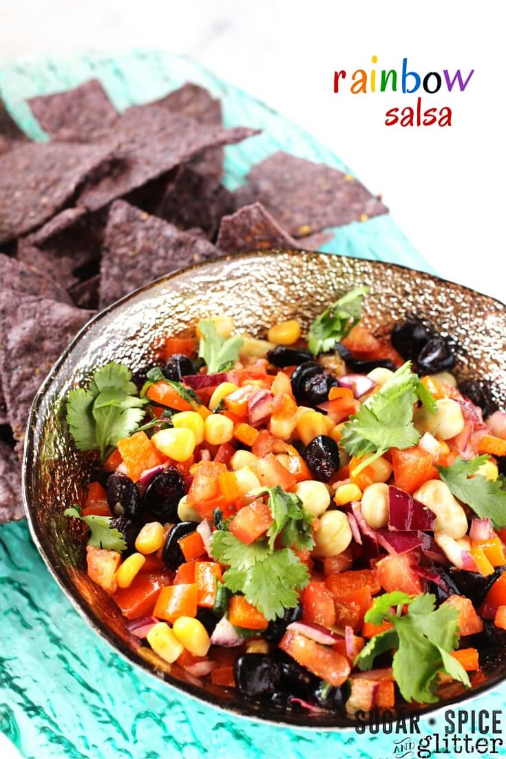 A healthy rainbow recipe your whole family will love! This fresh rainbow salsa lets your kids eat a rainbow of vegetables, while also being an easy healthy snack the grown-ups will love, too!