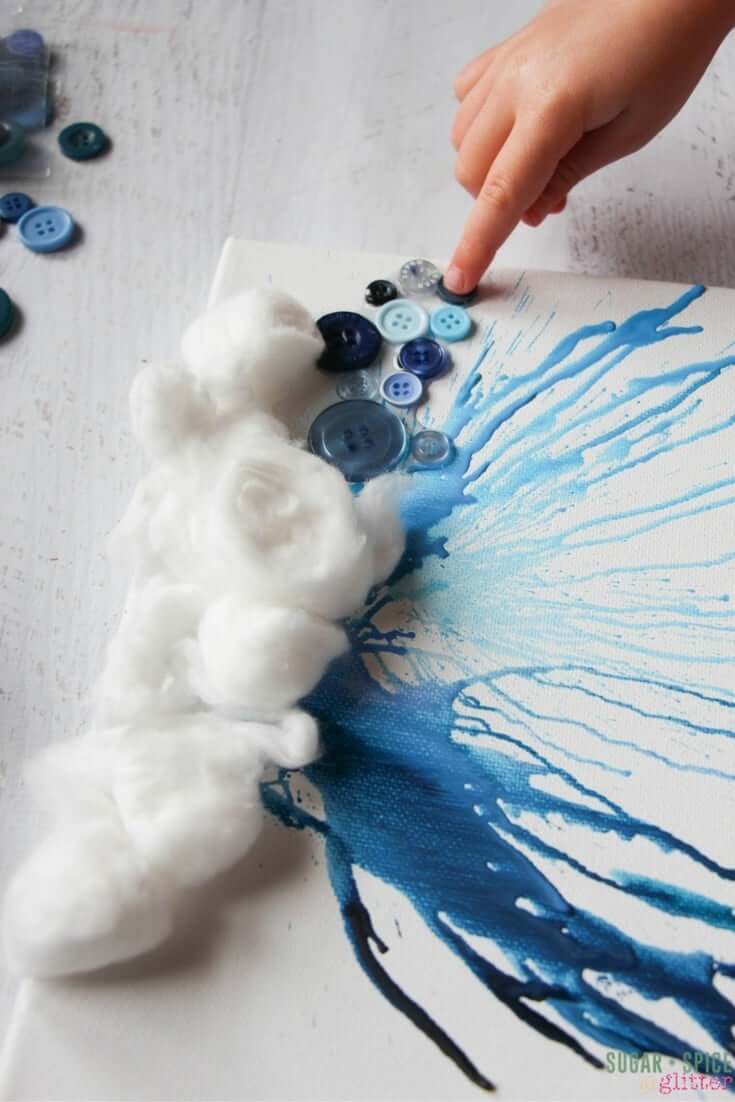 How amazing is this simple process art project for kids? A rain cloud painting created by melted crayons and other 3D materials