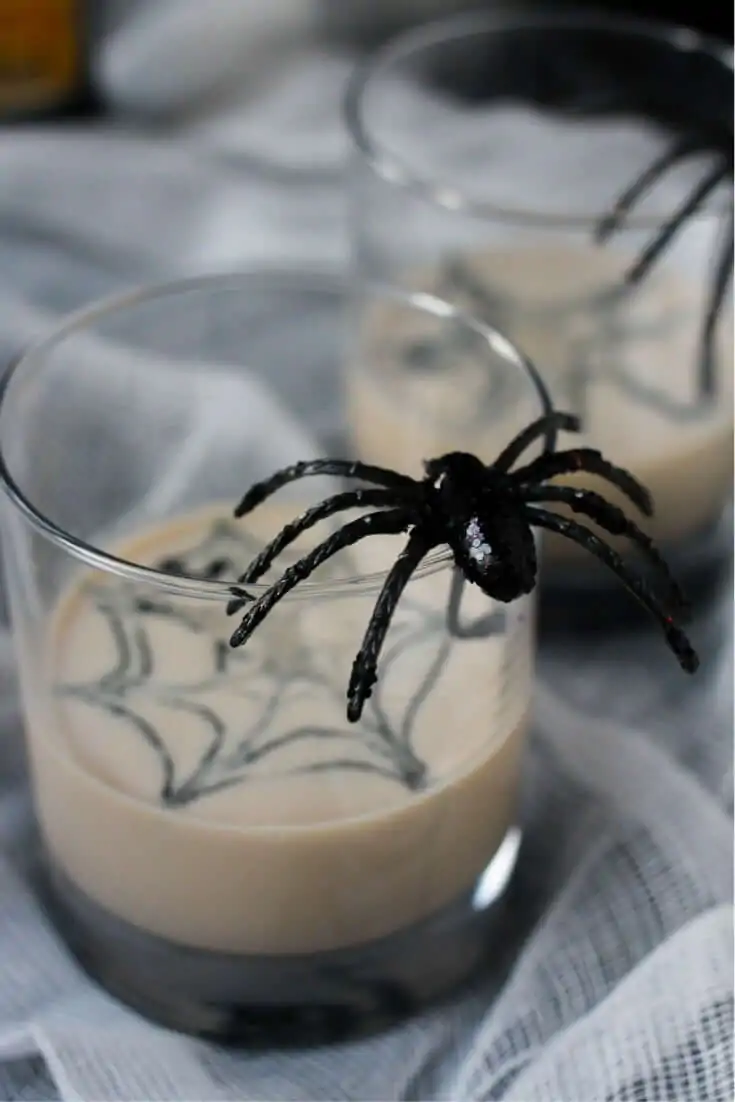 Spooky white russian cocktail recipe with a fun spiderweb design - perfect for a Halloween party
