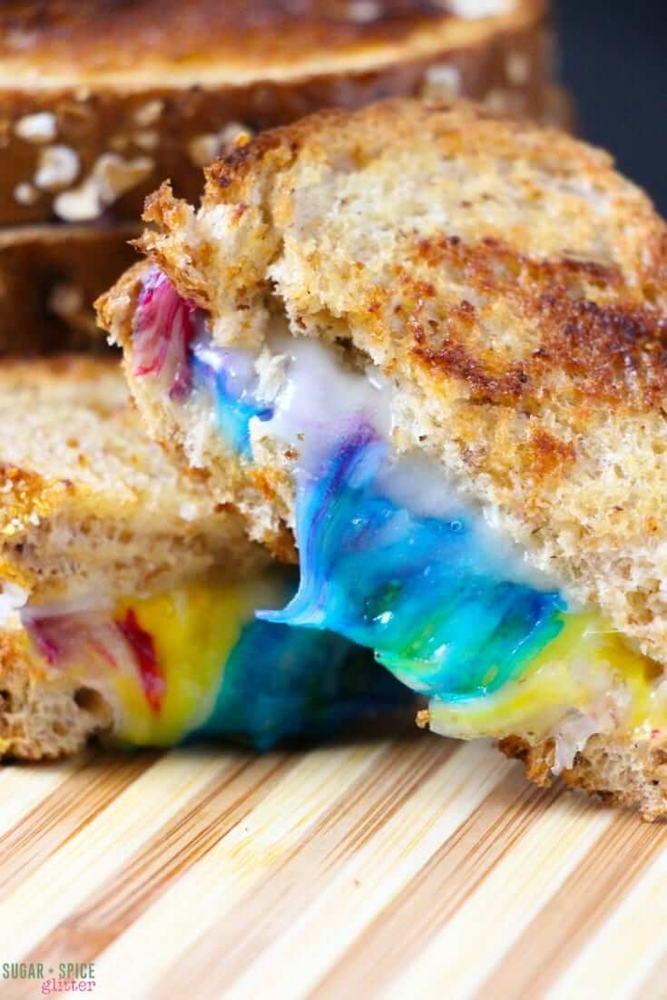 A delicious take on the rainbow recipe craze, this easy rainbow grilled cheese sandwich is a fun lunch idea that will put a smile on even the grumpiest of faces