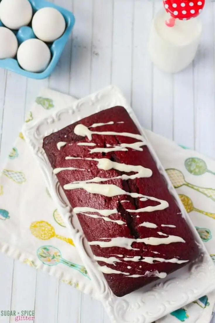 A rich and delicious red velvet tea cake with a perfect, not-too-sweet cream cheese drizzle perfect for a homemade gift or for serving to afternoon guests