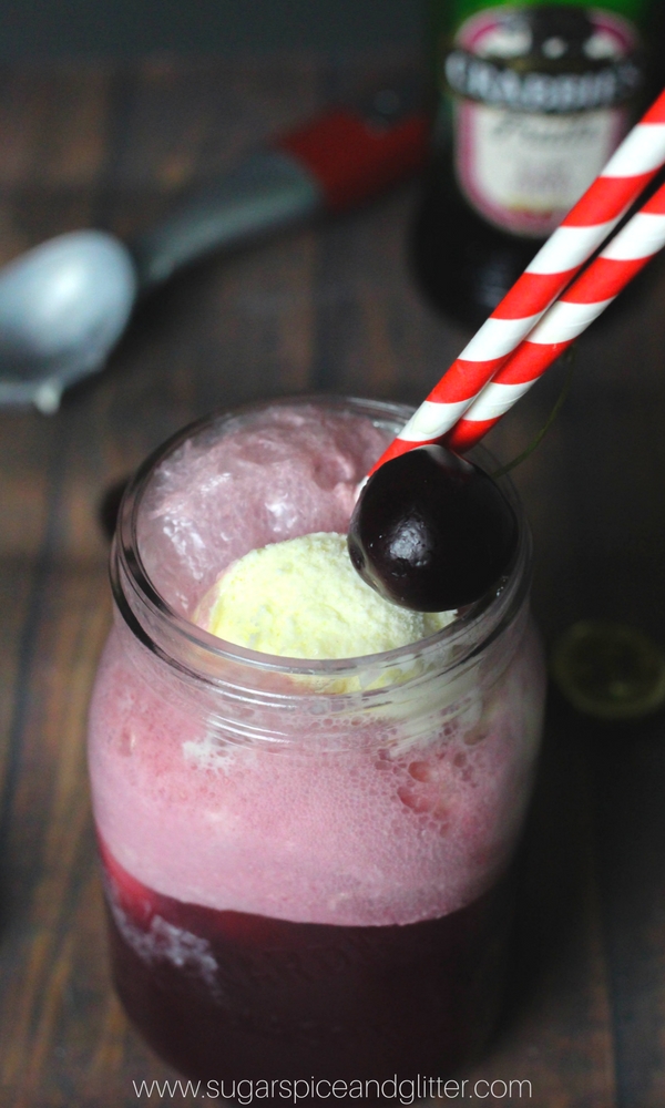 A cocktail float with fresh black cherries, vodka and vanilla ice cream