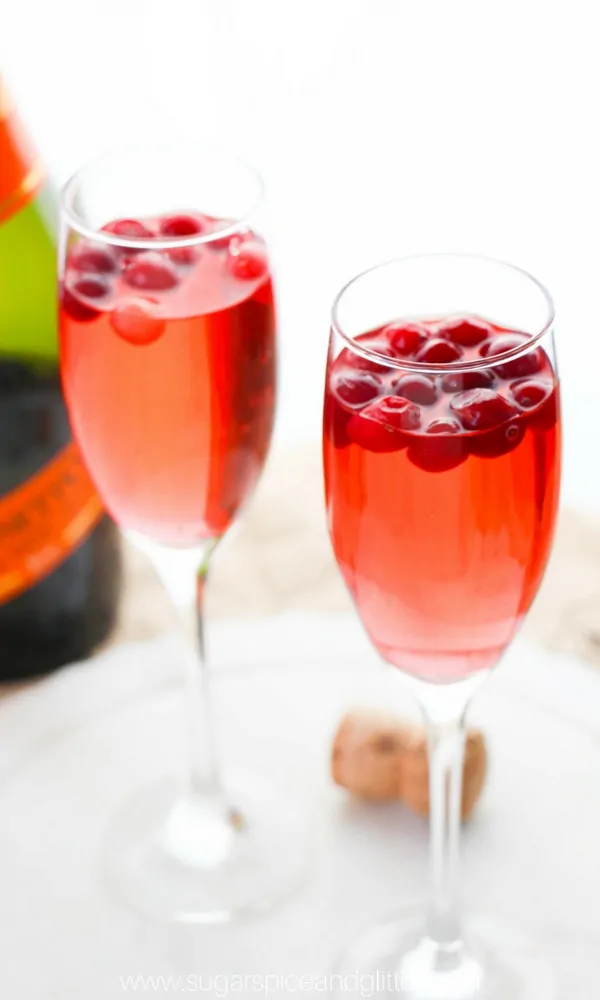 Cranberry Mimosa perfect for Thanksgiving or Christmas brunch - or any special fall occasion! Using cranberry ginger ale, this cranberry cocktail recipe is fizzy and unexpected treat