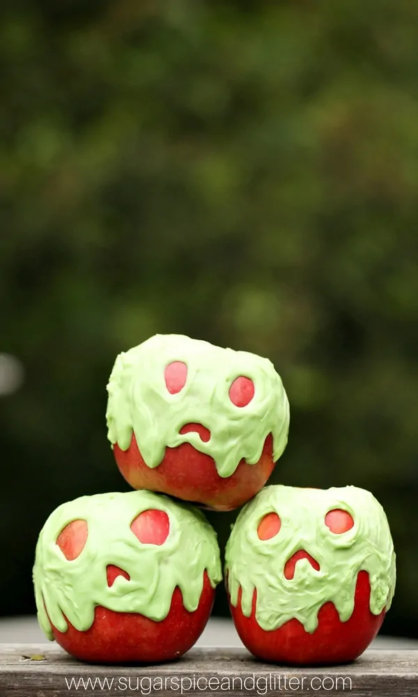 green gooey caramel apples with ghost faces