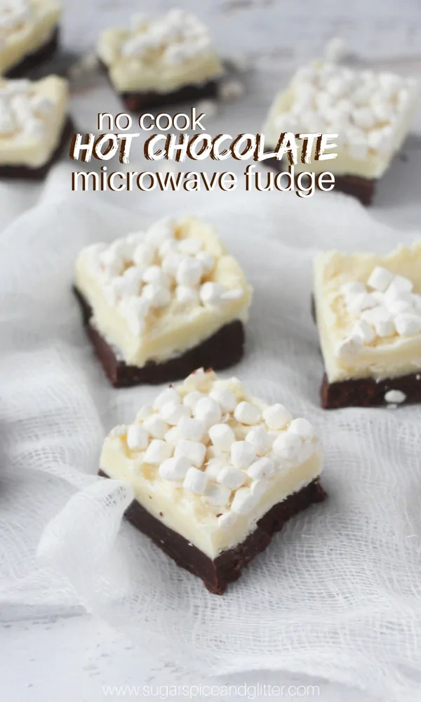Hot Chocolate Fudge - the perfect homemade fudge recipe. Half white chocolate, half milk chocolate and topped with hot chocolate marshmallows! An easy no-cook recipe kids can make, too!