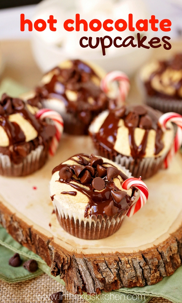A decadent from-scratch chocolate cupcake topped with a melted marshmallow "frosting". This fun hot chocolate cupcake features a candy cane handle to look like a little mug of hot chocolate. An easy winter cupcake kids can help make