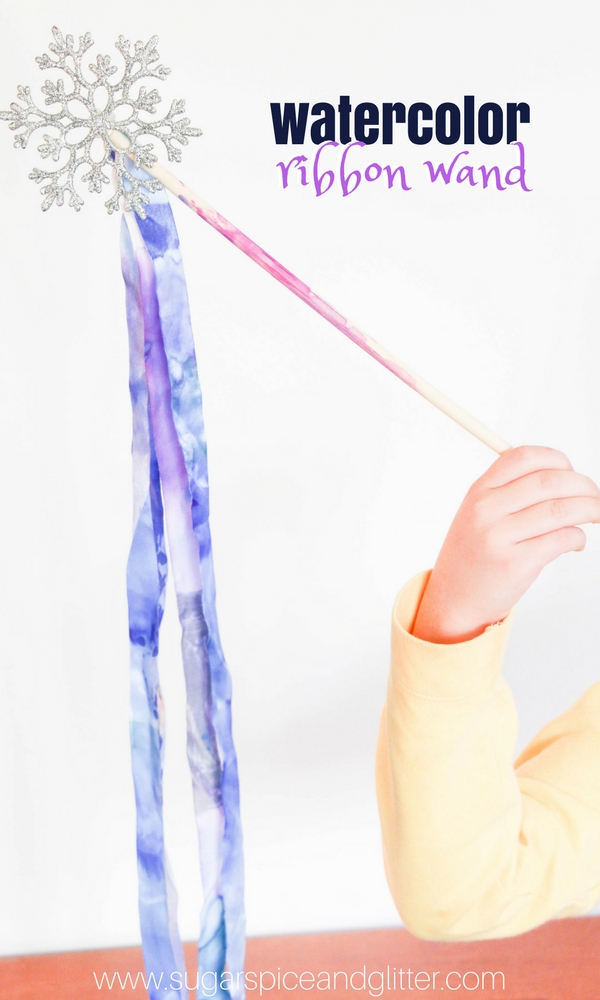 An awesome winter process art activity for kids, this watercolor ribbon wand is a beautiful winter craft for kids that would also be great for a Frozen birthday party.