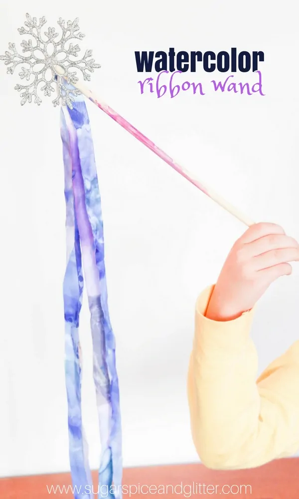 An awesome winter process art activity for kids, this watercolor ribbon wand is a beautiful winter craft for kids that would also be great for a Frozen birthday party.