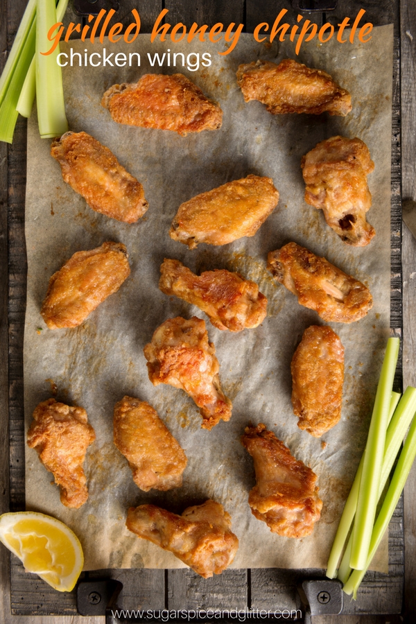 Crispy grilled chicken wings with a homemade honey chipotle sauce, perfect for a game night appetizer