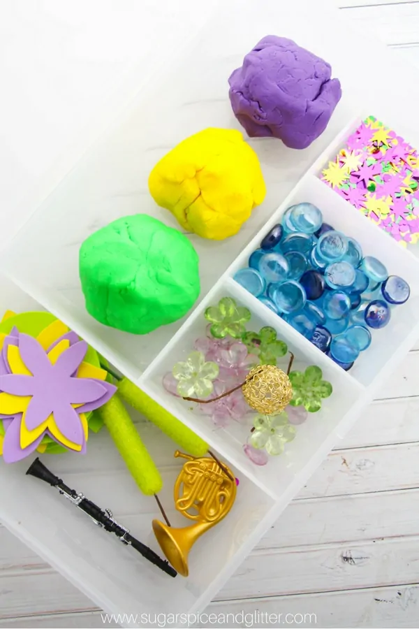 A simple Princess and the Frog homemade play dough kit - a fun Disney sensory play idea with elements from the classic fairy tale