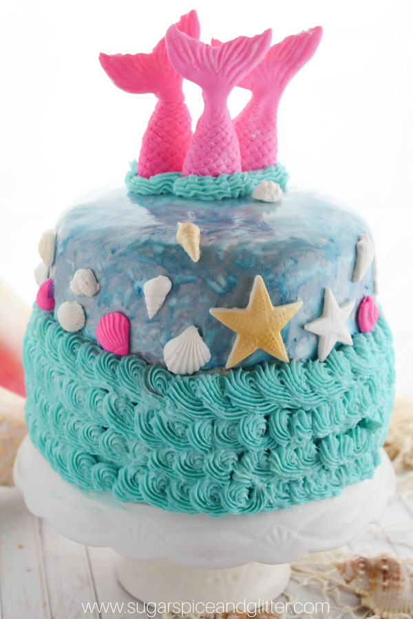How magical is this DIY mermaid cake?! A fondant and buttercream mermaid cake perfect for a mermaid birthday party