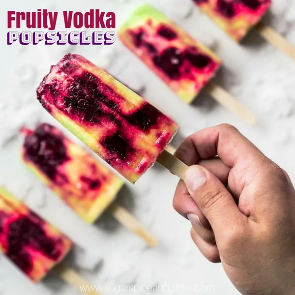 An alcoholic popsicle recipe using vodka, these fruity popsicles taste like a creamy berry-spiked pina colada