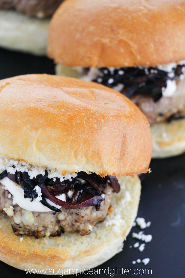 Simple lamb burger recipe topped with feta and caramelized onions for a sophisticated BBQ recipe for foodies