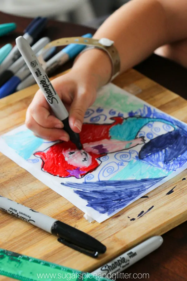 Grab your free printable for our easy 5-minute MERMAID CRAFT to bring some color to your windows on a rainy day