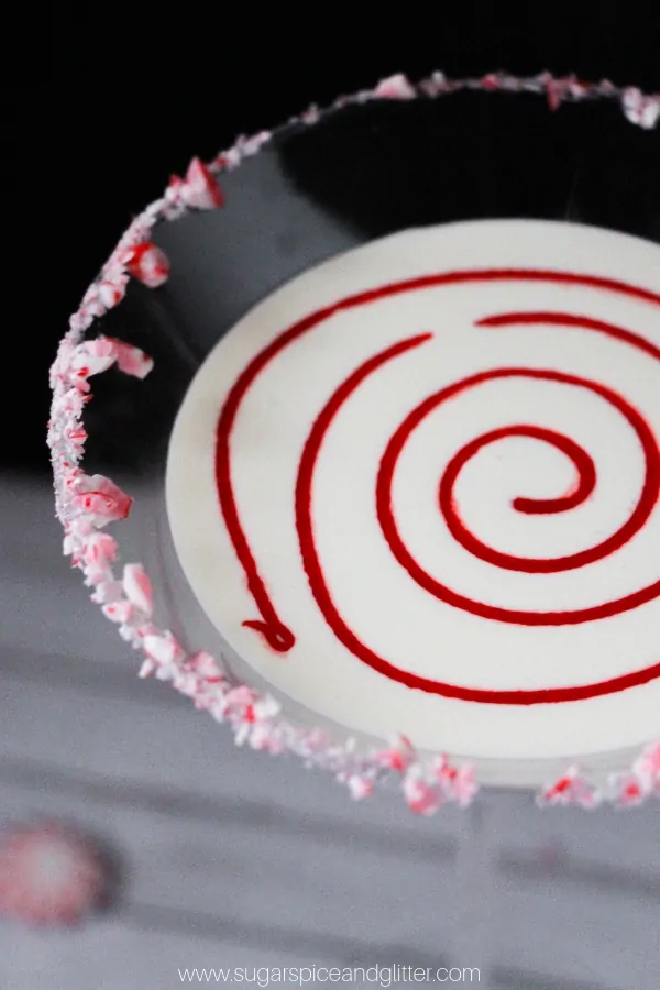 How cute is this fun Peppermint Martini with candy cane rim and candy swirl?!