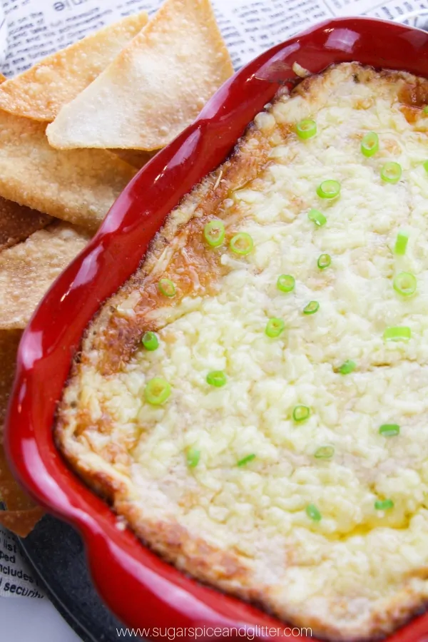 A cheesy crab dip served with fried wonton chips inspired by Crab Rangoon Wontons