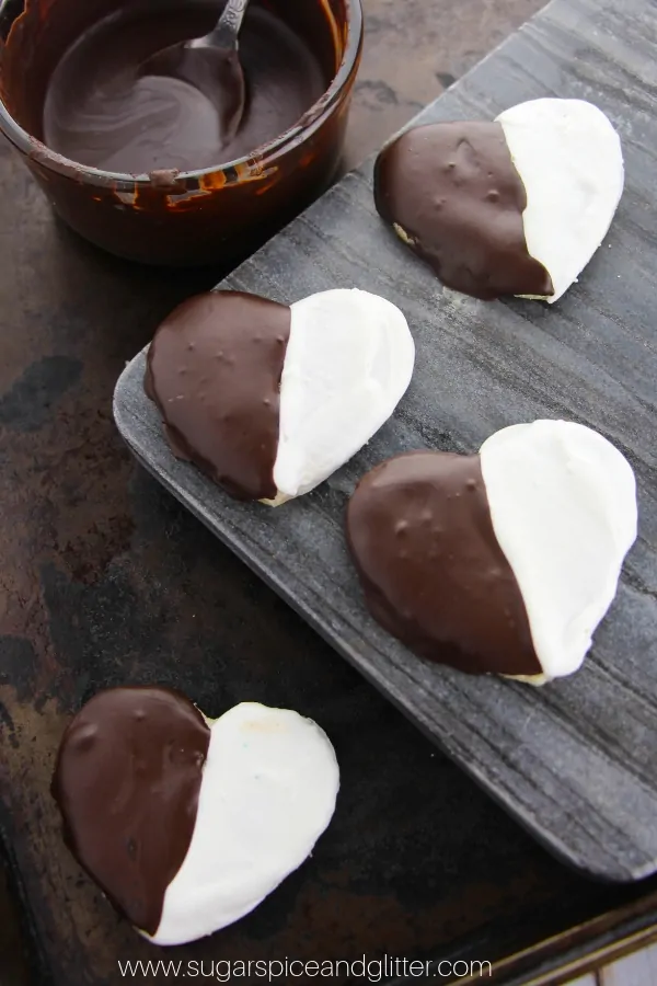 A NYC classic with a romantic twist, these Black and White cookies are made using homemade slice and bake sugar cookie dough