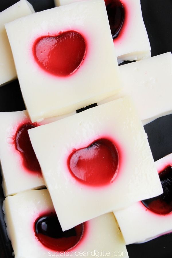 How to make Jello Jigglers with shape cut-outs inside! These Heart Cut-out Jello Squares a fun addition to your Valentine's Day Party menu