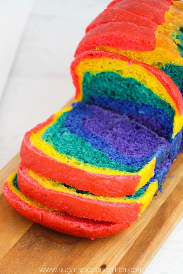 close-up of sliced rainbow sandwich bread on a cutting board