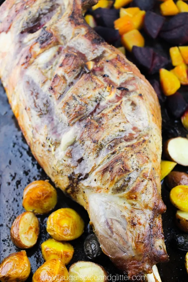 The Best leg of lamb recipe - roast leg of lamb with garlic and Italian seasonings served with mini potatoes and roasted beets