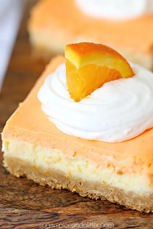 If you love Creamsicles, you're going to go crazy for this No-Bake Orange Cheesecake Bars recipe. No-Bake Creamsicle Cheesecake is the perfect party food