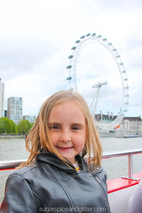 Riding a boat down the Thames River and seeing the London Eye, with the London Pass