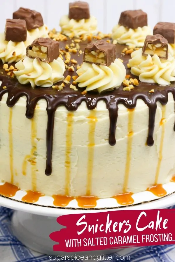 Three layers of chocolate cake. Homemade nougat filling. Salted caramel buttercream frosting. Chocolate ganache drips. You need this SNICKERS CAKE in your life!