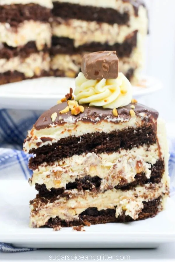 Would you look at this decadent triple chocolate Snickers cake with salted caramel frosting?! To die for!