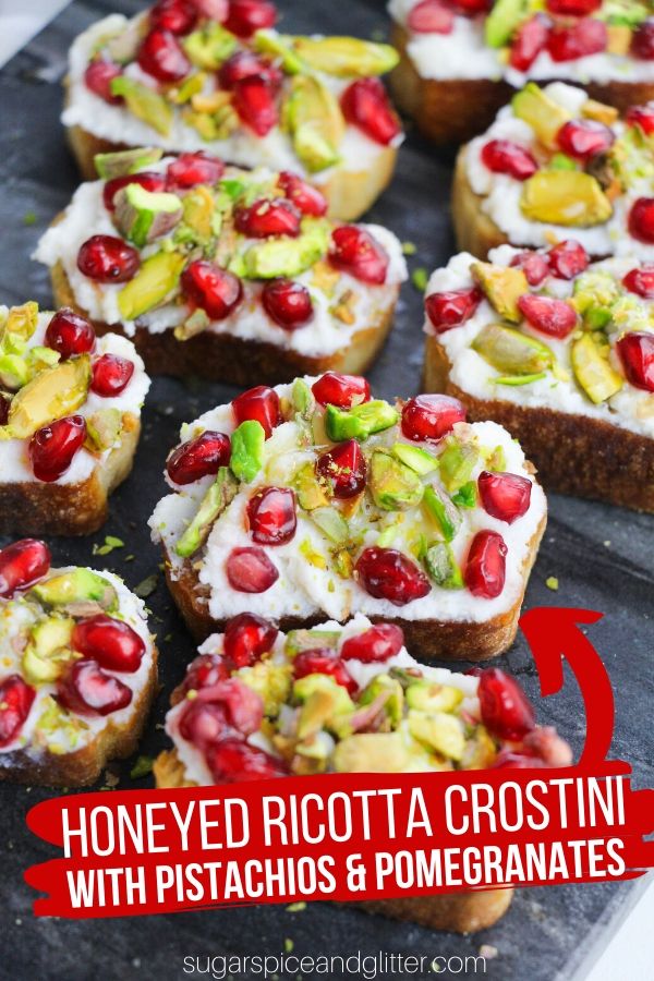 A super simple recipe for a honeyed ricotta crostini with pistachios and pomegrantes. This amazing appetizer is that perfect mix of creamy and crunchy, sweet, tangy and just a bit salty!