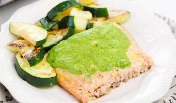 A simple baked salmon recipe with homemade chimichurri sauce - a heart-healthy meal your whole family will love