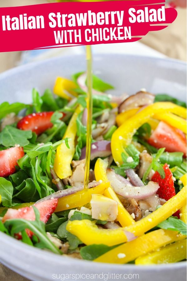 How to make the BEST Arugula Salad with Chicken, homemade Italian-dion dressing, charred peppers and red onions - and some strawberries and feta cheese to top it all off! This summer salad is perfect for helping you achieve your healthy eating goals