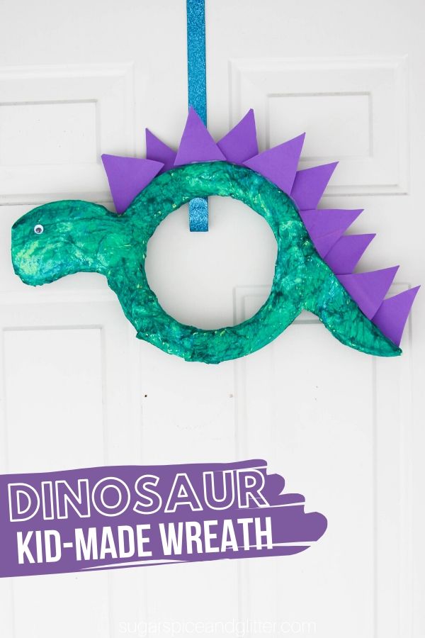This Dinosaur Wreath is a super simple dinosaur craft for kids to make, whether to add to a Dinosaur themed bedroom, Dinosaur party or give as a fun Father's Day gift